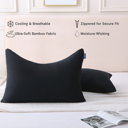 Two curved black Cushyz bamboo cooling pillow covers on pillows in a minimalist bedroom setting, labeled with features: cooling and breathable, ultra-soft bamboo fabric, hidden zipper for secure fit, and moisture wicking.