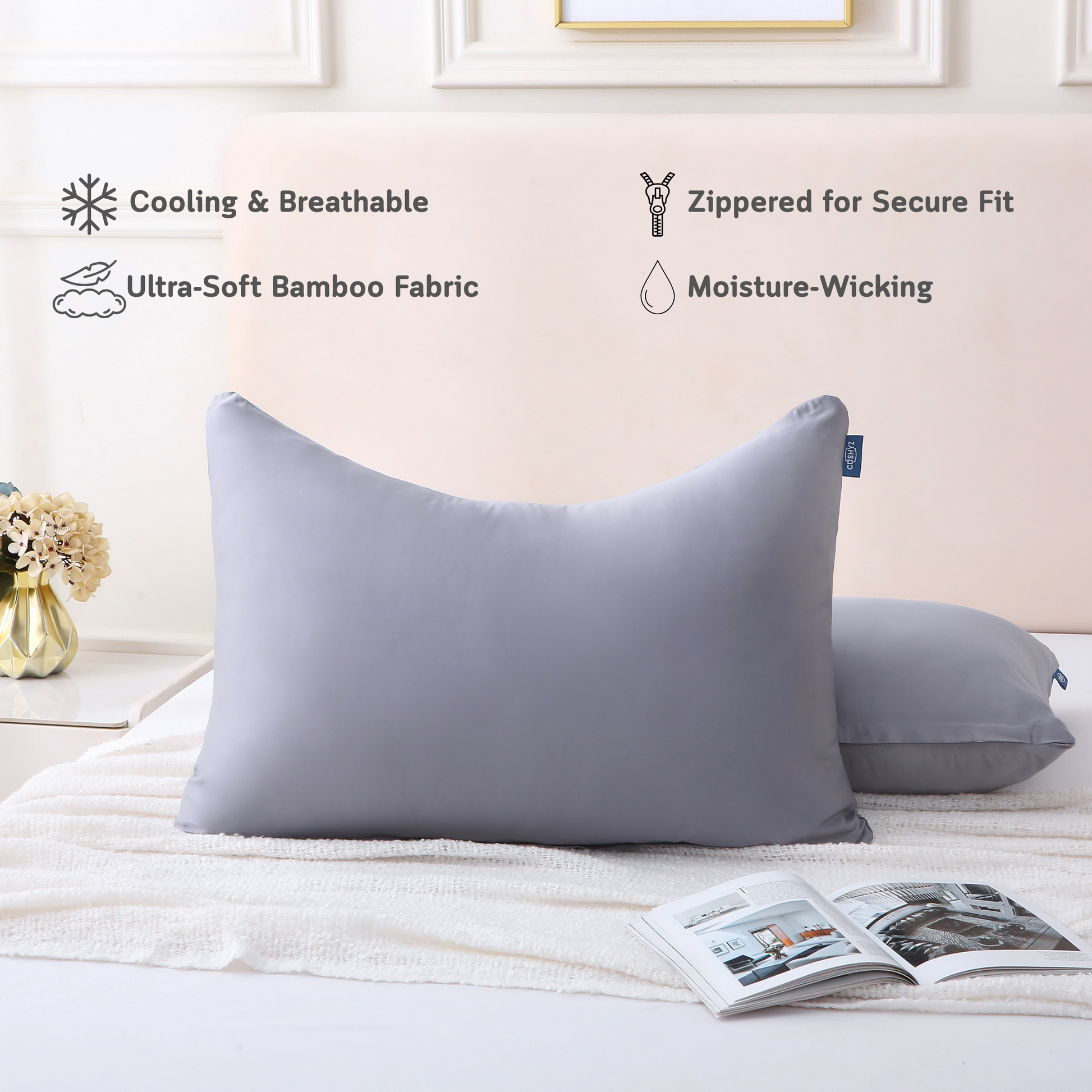 Two curved gray Cushyz bamboo cooling pillow covers on pillows in a minimalist bedroom setting, labeled with features: cooling and breathable, ultra-soft bamboo fabric, hidden zipper for secure fit, and moisture wicking.