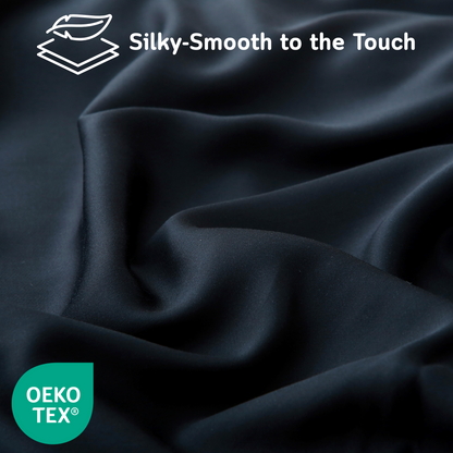 Close-up of black Cushyz bamboo cooling pillow cover with silky-smooth fabric texture, labeled “Silky-Smooth to the Touch” and featuring OEKO-TEX certified logo.