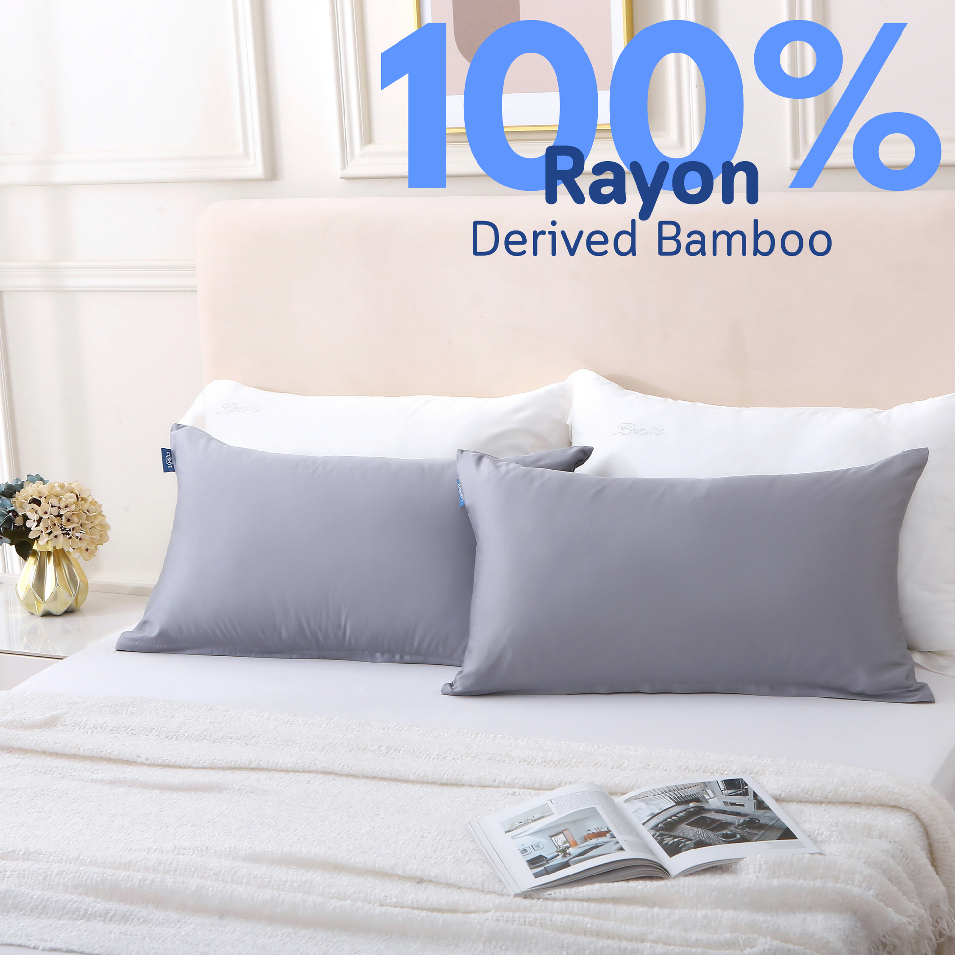 Two pillows in gray Cushyz bamboo cooling pillow covers are neatly placed on a bed, labeled 100% rayon derived from bamboo.